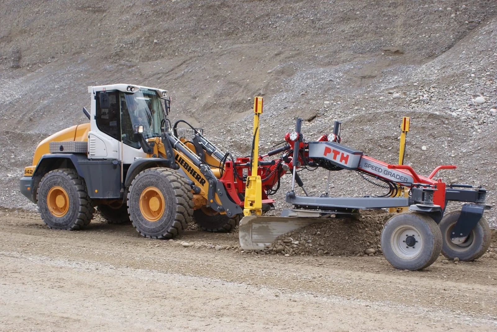 PTH Front Grader on the front of a wheel loader