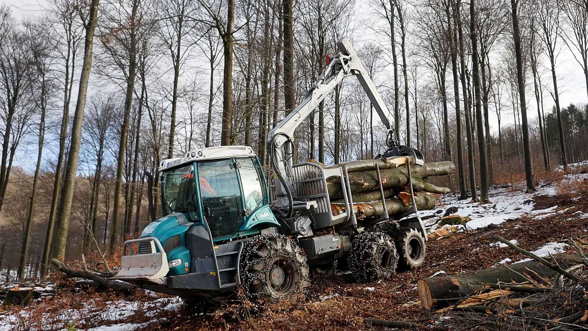 Pfanzelt Felix 214.5 6WD carrying a load of timber in its stanchion basket