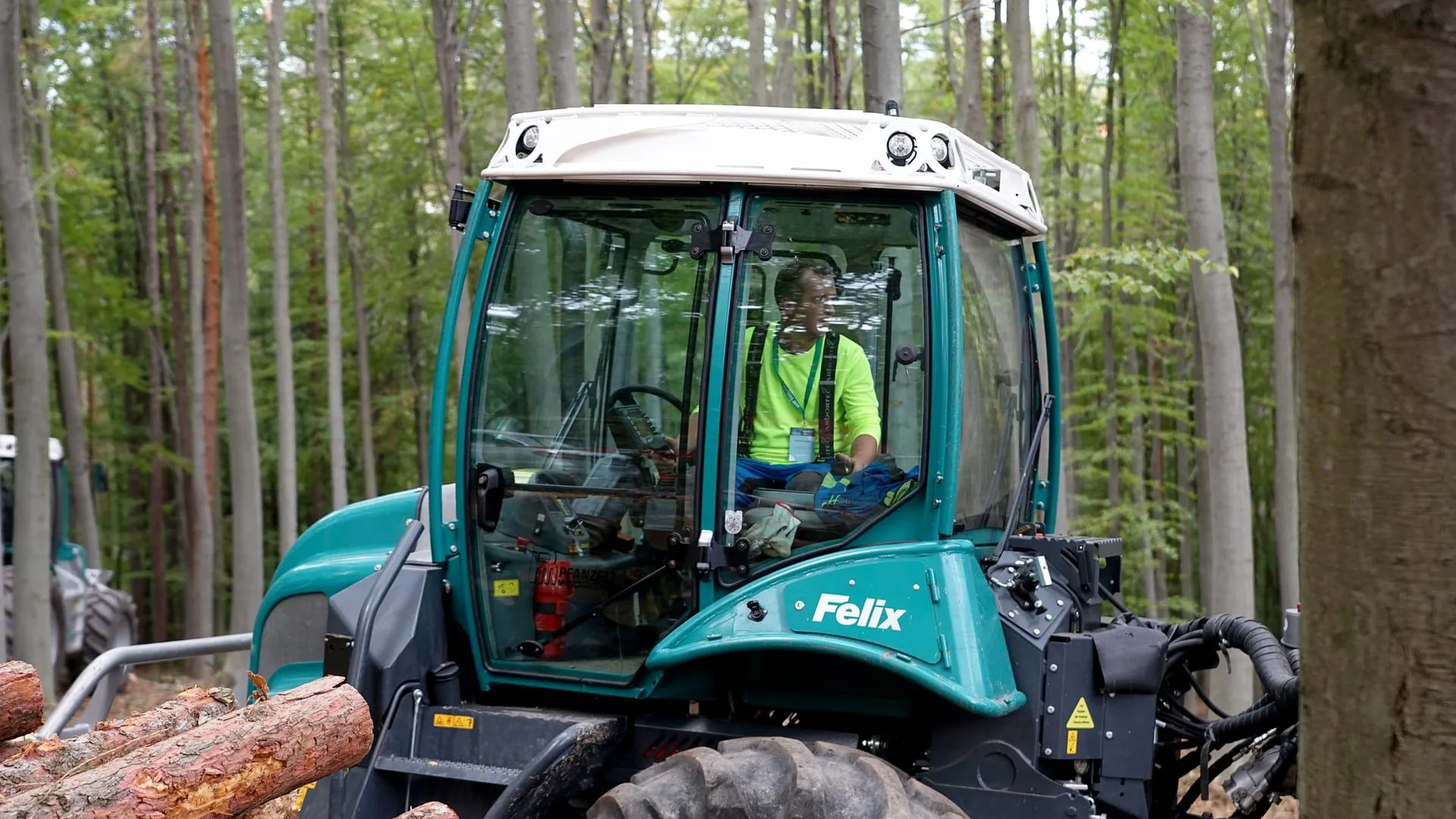 An operator in the Felix cab, with the crane controls on the seat