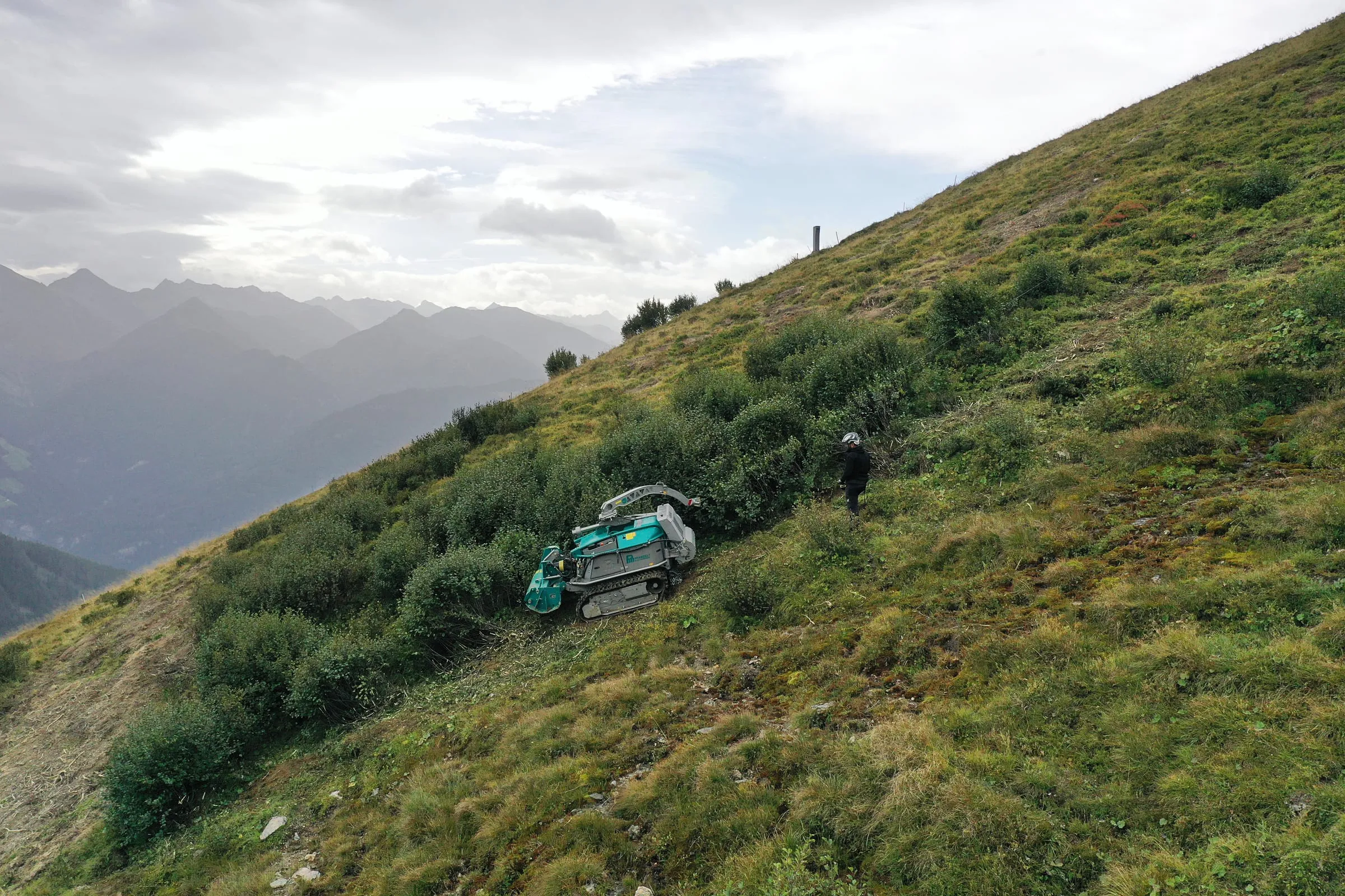 Pfanzelt Moritz on a steep alpine slope, held by its traction winch