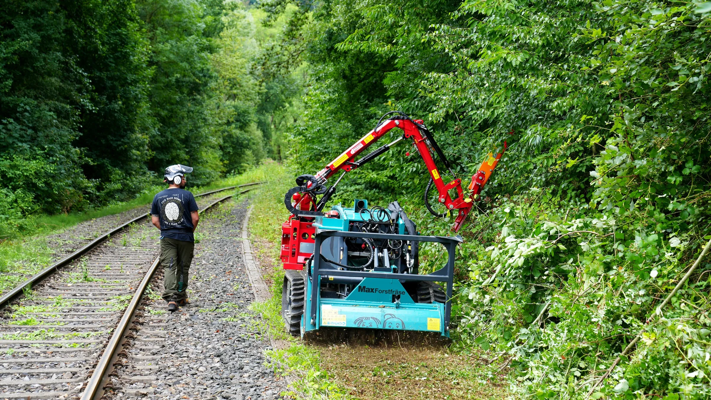 Pfanzelt Moritz with a hedge trimmer working beside a railway line