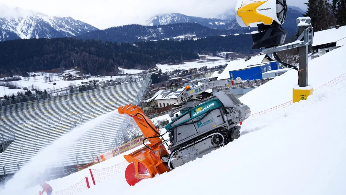Pfanzelt Moritz clearing a ski slope with a snow blower, held by its traction winch