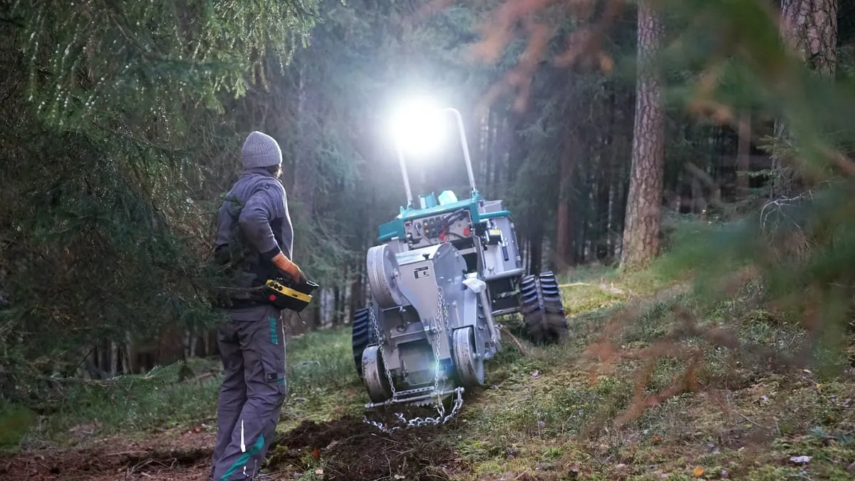 Pfanzelt Moritz with the sowing-strip mulcher in a forest at dusk